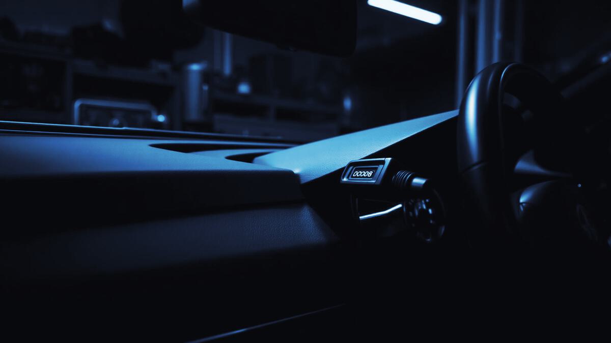 Vehicle diagnostic (OBD) port under a dashboard